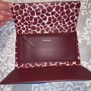 Burgundy / plum Anne Klein large wallet.